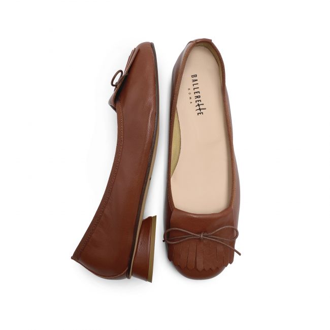 Brown leather moccasins with heel and fringes