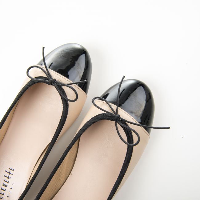 Powder pink leather ballet flats and black patent toe