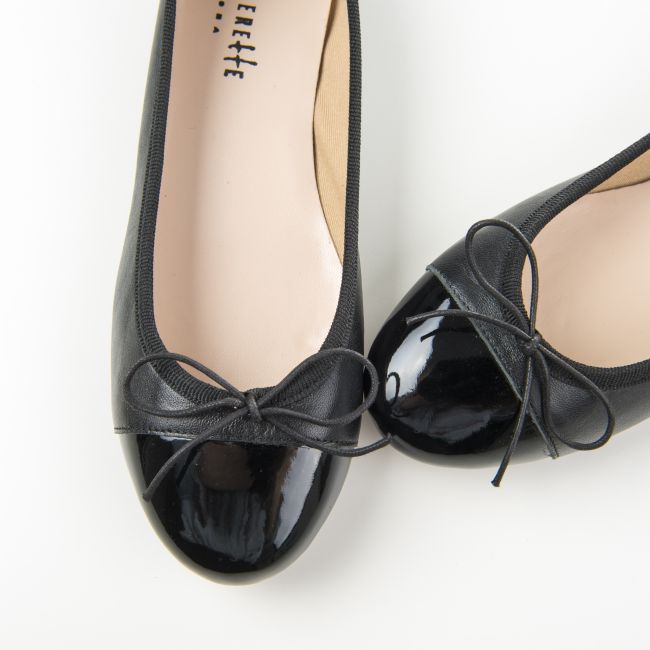 Black leather ballet flats and black patent toe