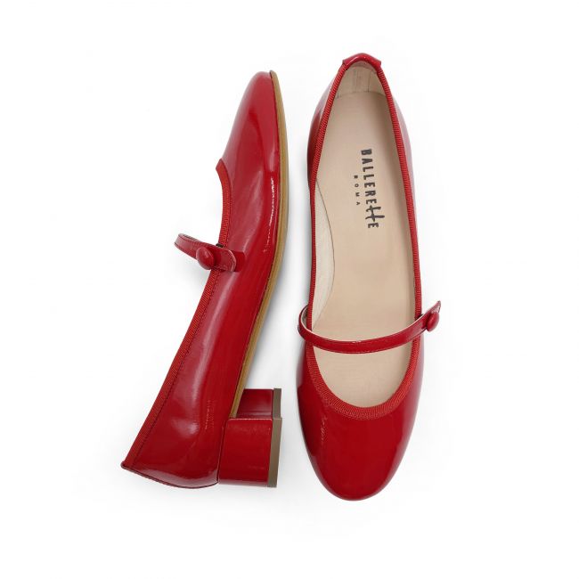 Red patent leather ballet flats with strap and heel