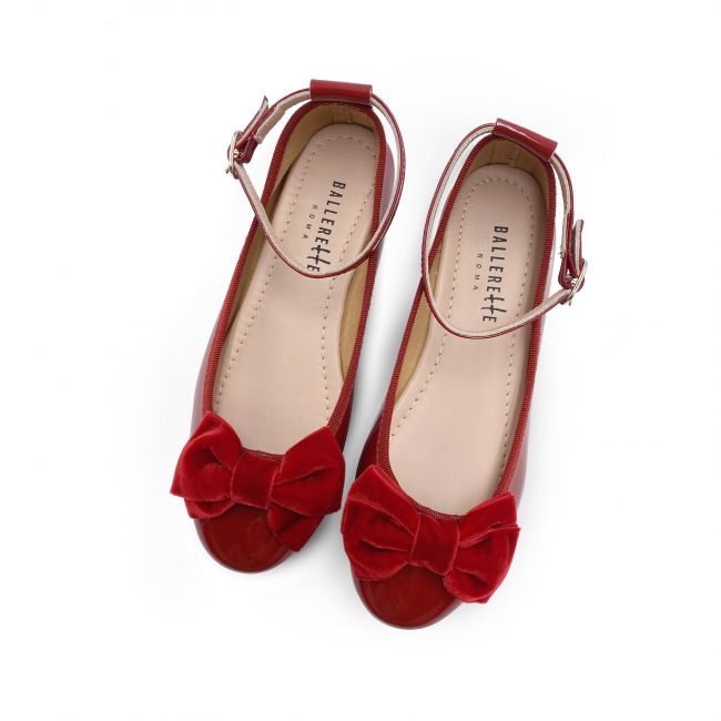 Girl's ballet flats in red patent leather with velvet bow